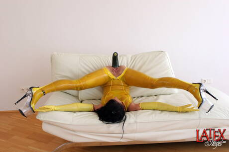 Latex Angel are pleased to offer you a free pictures featuring teenage girl in scene with inserting a toy in cunt